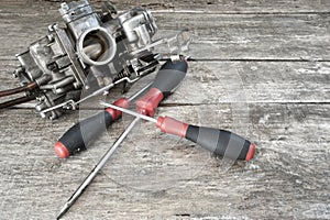 Carburetor and screwdrivers photo