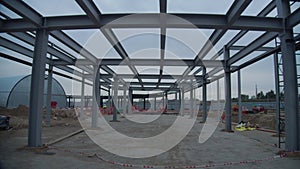 Carcass of metal beams and hangar building at sports arena