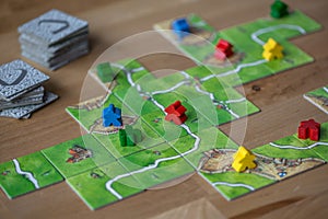 Carcassonne board game being played on a table top