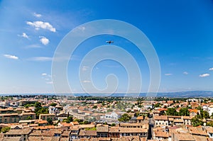 Carcassonne, France. The picturesque landscape with a plane flying over the city