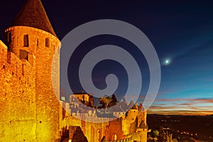 Carcassonne medieval fortress highlighted night view with moon i