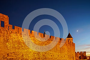 Carcassonne medieval fortress highlighted night view with moon i