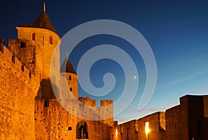 Carcassonne medieval fortress highlighted night view with moon i