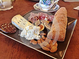 Carcuterie plate with bred brie and salumi photo