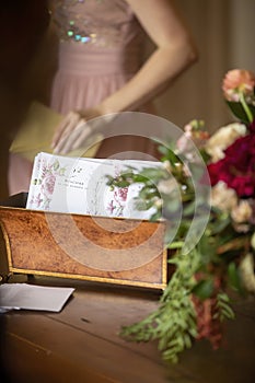 Card bin holding welcome cards for a wedding ceremony