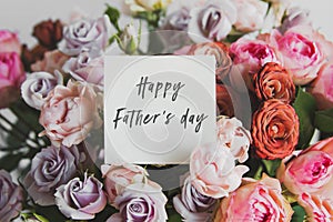 card for a bouquet with the inscription happy fathers day in a bright beautiful bouquet of flowers roses