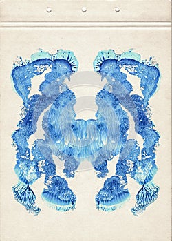 Card of color Rorschach inkblot test. A sheet of old paper stained with blue symmetric watercolor blots. Grunge artistic backgroun