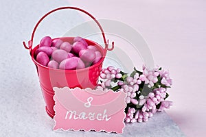 Card, flowers, bucket and confectionery.