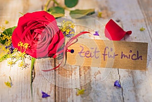 Card with german text, Zeit fuer mich, means time for me and romantic red rose flower for Mothers Day or Valentines Day