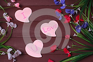 Card with Message Love You on the Letter on wooden background