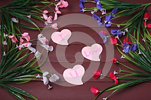 Card with Message Love You on the Letter on wooden background