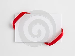 Card notes with red ribbons