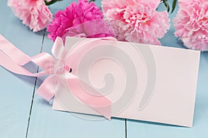 Card with pink ribbon bow and Carnation flowers