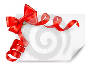 Card with red gift bow with ribbons