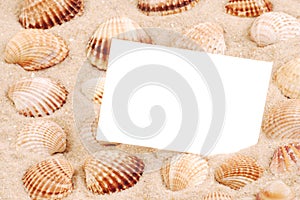 CARD ON SAND WITH SEA SHELL