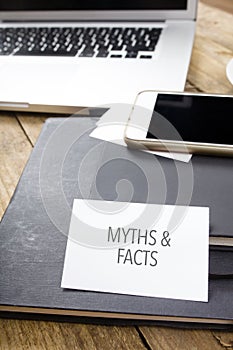 Card saying Myths & Facts on note pad