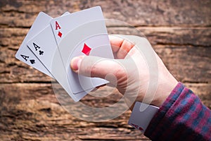 Card sharper holds cards and aces in the sleeve