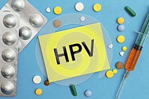 Card with text HPV, pills and syringe