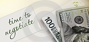 Card with text Time To Negotiate and money. Business concept photo