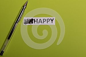 card with text unhappy, erease word & x27;un& x27; so it written & x27;happy& x27;. Copy space. Lime background. Studio shoot photo