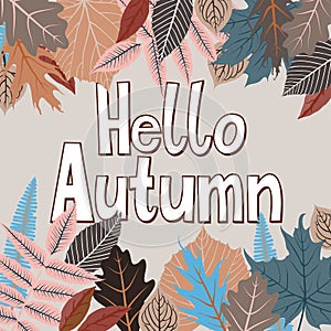 Card with words hello autumn and fall leaves