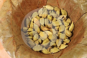 Cardamom on a natural leaf bowl