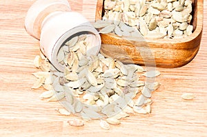 Cardamom pods on the wooden background