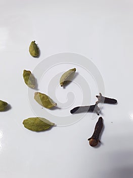 Cardamom seeds and clove seeds photo