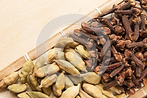 Cardamom seeds and cloves