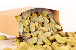 Cardamom seeds or Green Elaichi on a white.