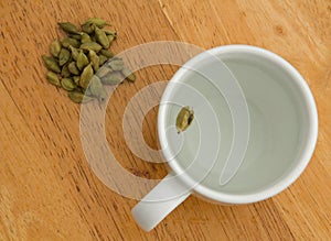 Cardamom tea in a white cup