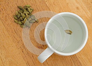 Cardamom tea in a white cup