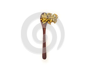 Cardamom in the wooden spoon white background, Top view