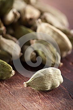 Cardamome seeds on wooden table