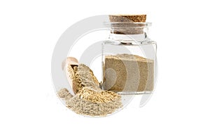 Cardamon powde in wooden scoop and jar on isolated on white background. front view. spices and food ingredients