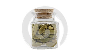 Cardamon seeds in glass  jar on isolated on white background. front view. spices and food ingredients
