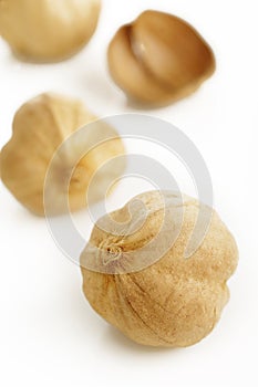 Cardamon seeds on a white background