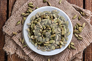 Cardamon Seeds on wooden background