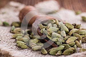 Cardamon Seeds on wooden background