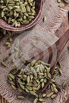 Cardamon Seeds on wooden background