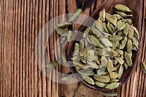 Cardamon Seeds on wooden background
