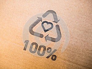 Cardboard box with 100% recycling printed label logo sign.