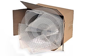 Cardboard box with bubble wrap on a white background