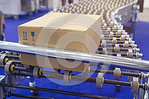 Cardboard box on conveyor belt