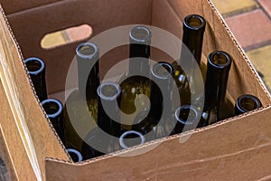 Cardboard box with empty wine bottles prepared for bottling