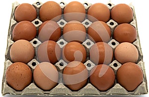 A cardboard box of fresh eggs on a white background