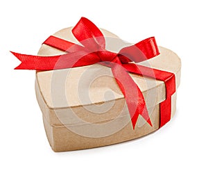 Cardboard box with heart-shaped red ribbon tied round with a bow