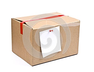 Cardboard box with pinned note