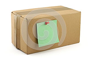 Cardboard box with pinned note