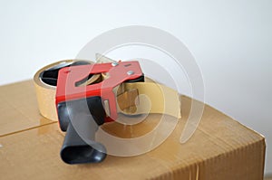 Cardboard box and tape dispenser